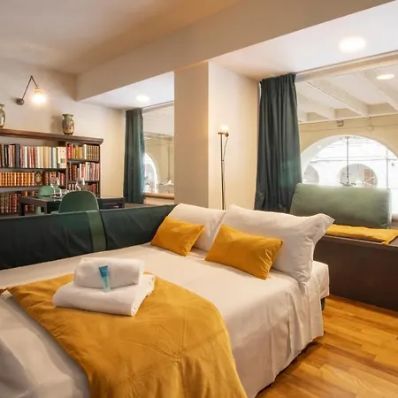 Apartment Bed & Books By Wonderful Italy